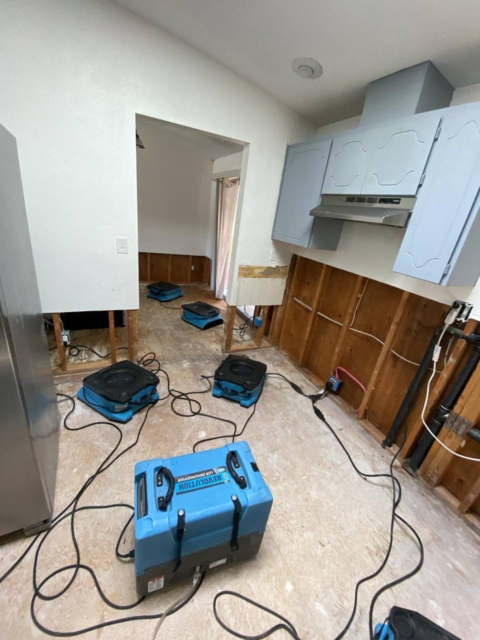 Drying equipment set up in a flooded kitchen