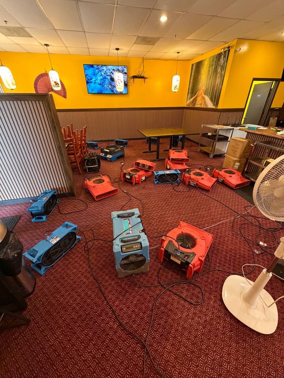 Water damage drying equipment in a restaurant dining room