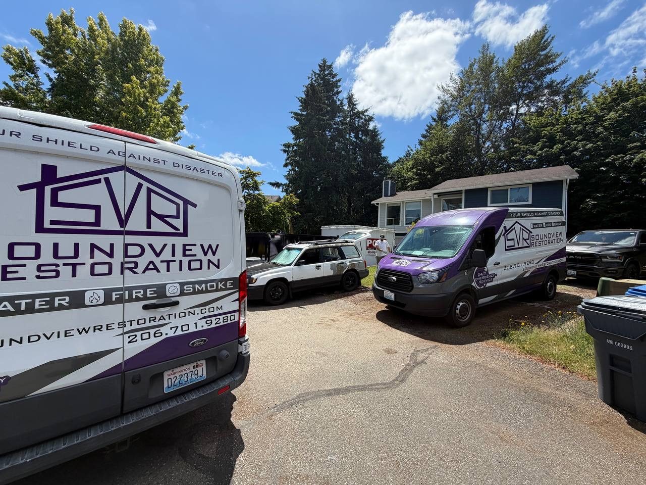 Soundview Restoration fleet vans arriving at a job site
